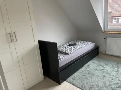 Ein Bett oder Betten in einem Zimmer der Unterkunft Monteurwohnung - Pforzheim Nordstadt - L8