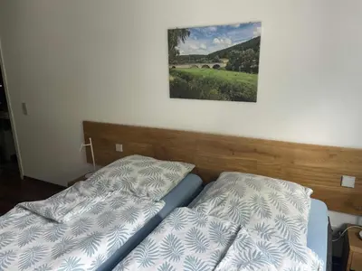 Ein Bett oder Betten in einem Zimmer der Unterkunft Gästehaus Jagsttal