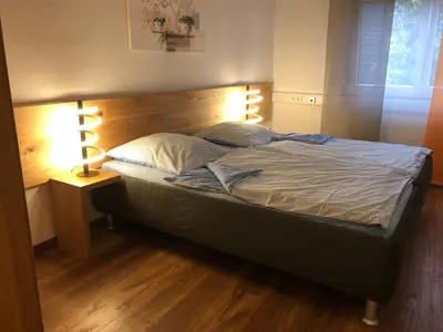 Ein Bett oder Betten in einem Zimmer der Unterkunft Gästehaus Jagsttal