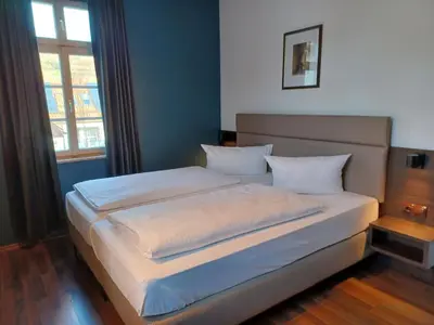 Ein Bett oder Betten in einem Zimmer der Unterkunft Hotel Klosterpost