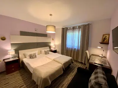 Ein Bett oder Betten in einem Zimmer der Unterkunft Hotel Attaché