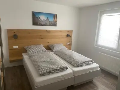 Ein Bett oder Betten in einem Zimmer der Unterkunft Ferienwohnung EG Heppenheim