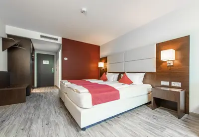 Ein Bett oder Betten in einem Zimmer der Unterkunft Raitelberg Resort