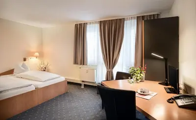 Ein Bett oder Betten in einem Zimmer der Unterkunft Sunibel Inn