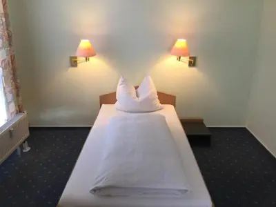 Ein Bett oder Betten in einem Zimmer der Unterkunft Sunibel Inn