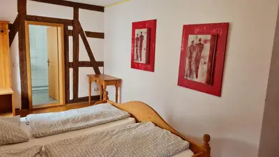 Ein Bett oder Betten in einem Zimmer der Unterkunft Hotel Kartäuser Hof Mainz Bodenheim