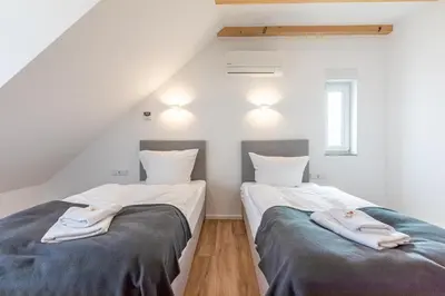 Ein Bett oder Betten in einem Zimmer der Unterkunft Diana Boardinghouse KONTAKTLOSER SELF CHECK IN & SELF CHECK OUT