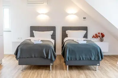 Ein Bett oder Betten in einem Zimmer der Unterkunft Diana Boardinghouse KONTAKTLOSER SELF CHECK IN & SELF CHECK OUT