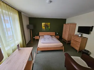Ein Bett oder Betten in einem Zimmer der Unterkunft Hotel Donnersberg