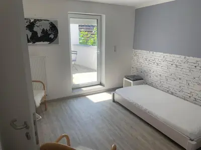 Ein Bett oder Betten in einem Zimmer der Unterkunft Joanna Apartment - Weinheim