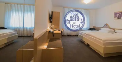 Ein Bett oder Betten in einem Zimmer der Unterkunft Hotel am Wasen
