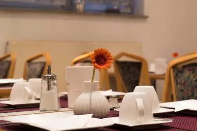 Ein Restaurant oder anderes Speiselokal in der Unterkunft Hotel am Wasen