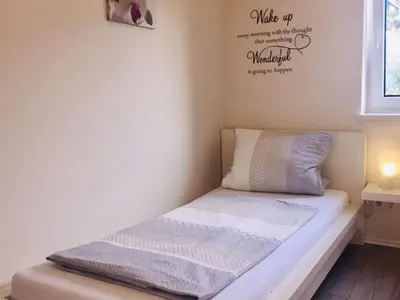 Ein Bett oder Betten in einem Zimmer der Unterkunft Ferienwohnung Stafflel - Wohlfühlen im Odenwald