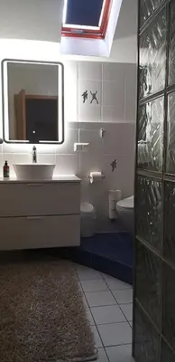 Ein Badezimmer in der Unterkunft SECRA Exclusive Maisonette-Ferienzimmer Am Backhausgarten