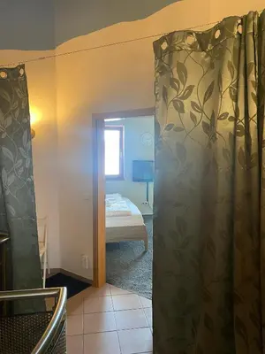 Ein Bett oder Betten in einem Zimmer der Unterkunft SECRA Exclusive Maisonette-Ferienzimmer Am Backhausgarten