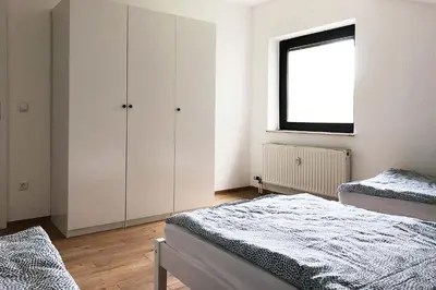 Ein Bett oder Betten in einem Zimmer der Unterkunft 4 Zimmer Ferienwohnung Egelsbach