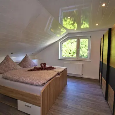 Ein Bett oder Betten in einem Zimmer der Unterkunft FeWo 4 - Erpolzheim