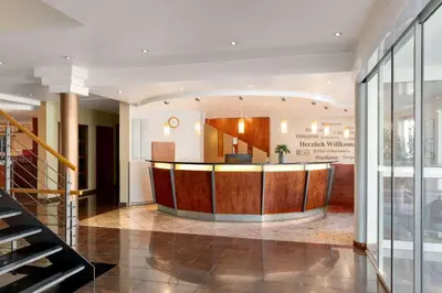 Lobby/Rezeption in der Unterkunft Amedia Frankfurt Russelsheim Trademark Collection by Wyndham