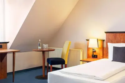 Ein Bett oder Betten in einem Zimmer der Unterkunft Amedia Frankfurt Russelsheim Trademark Collection by Wyndham