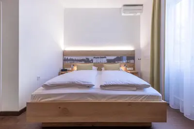 Ein Bett oder Betten in einem Zimmer der Unterkunft Villa Benz Hotel garni