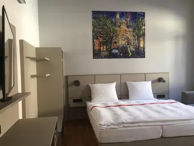 Ein Bett oder Betten in einem Zimmer der Unterkunft Maximilian