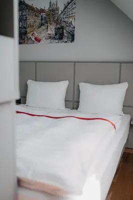 Ein Bett oder Betten in einem Zimmer der Unterkunft Maximilian
