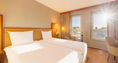Ein Bett oder Betten in einem Zimmer der Unterkunft The Q - Quadro City Hotel