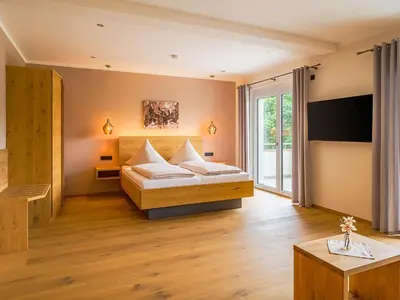 Ein Bett oder Betten in einem Zimmer der Unterkunft Main-Vinotel Weingut Helmstetter