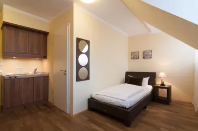 Ein Bett oder Betten in einem Zimmer der Unterkunft GuestHouse Heidelberg