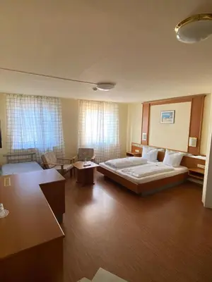 Ein Bett oder Betten in einem Zimmer der Unterkunft Hotel Weller