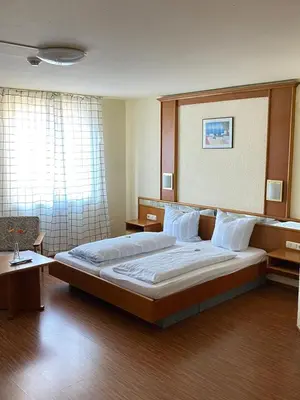 Ein Bett oder Betten in einem Zimmer der Unterkunft Hotel Weller
