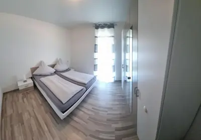 Ein Bett oder Betten in einem Zimmer der Unterkunft Ludwigshöhe EG
