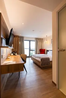 Ein Bett oder Betten in einem Zimmer der Unterkunft Weinzuhause Hotel-Restaurant-Vinothek