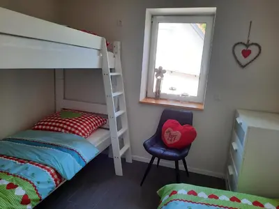 Ein Bett oder Betten in einem Zimmer der Unterkunft Ferienhaus auf dem Lusitanohof Jäger