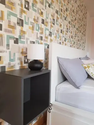 Ein Bett oder Betten in einem Zimmer der Unterkunft Ferienhaus Anno 1903