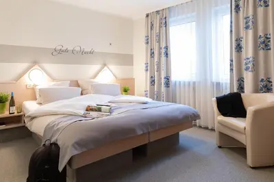 Ein Bett oder Betten in einem Zimmer der Unterkunft Hotel Hamm