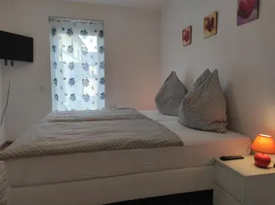 Ein Bett oder Betten in einem Zimmer der Unterkunft Ferienwohnung Christoph,nahe Burg Steinsberg