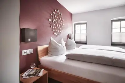 Ein Bett oder Betten in einem Zimmer der Unterkunft Hotel Landlust St. Martin