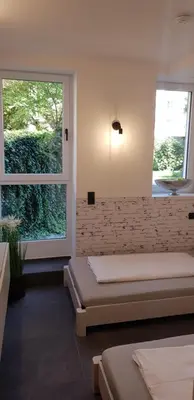 Ein Bett oder Betten in einem Zimmer der Unterkunft Joanna Apartment - MA Lindenhof