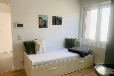 Ein Bett oder Betten in einem Zimmer der Unterkunft Ferienwohnung Sandhausen Heidelberg V1