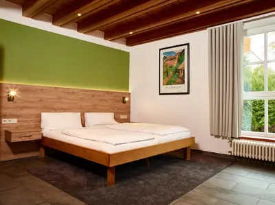 Ein Bett oder Betten in einem Zimmer der Unterkunft Hotel & Restaurant Burgschänke