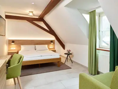 Ein Bett oder Betten in einem Zimmer der Unterkunft Hotel & Restaurant Burgschänke