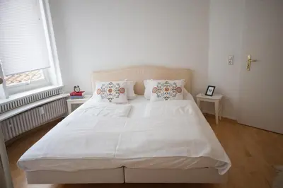 Ein Bett oder Betten in einem Zimmer der Unterkunft Heidelberg Apheartments