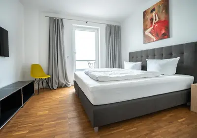 Ein Bett oder Betten in einem Zimmer der Unterkunft Prime Park Penthouse Aschaffenburg