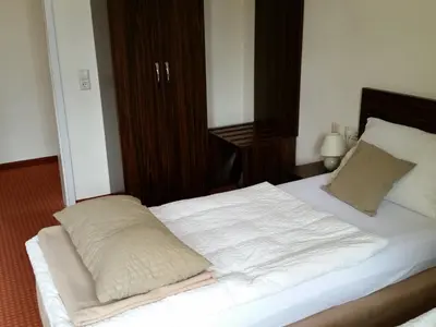 Ein Bett oder Betten in einem Zimmer der Unterkunft Linde Restaurant & Hotel