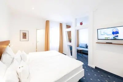 Ein Bett oder Betten in einem Zimmer der Unterkunft Hotel Adler Post