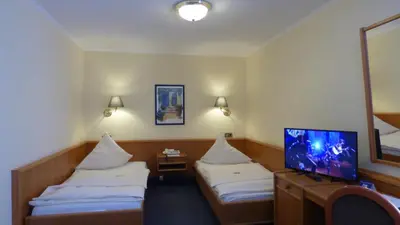 Ein Bett oder Betten in einem Zimmer der Unterkunft Central Hotel