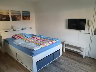 Ein Bett oder Betten in einem Zimmer der Unterkunft Ferienwohnung Raiffeisenstraße - Obernburg