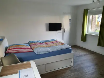 Ein Bett oder Betten in einem Zimmer der Unterkunft Ferienwohnung Raiffeisenstraße - Obernburg