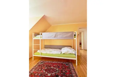 Ein Bett oder Betten in einem Zimmer der Unterkunft Ferienhaus CASA PI mit Gemeinschaftgarten